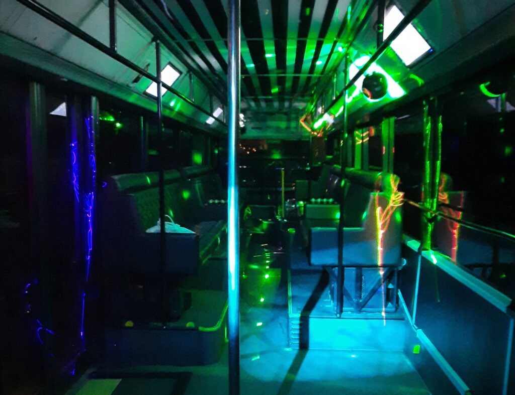 The interior of a vibrant party bus, a popular activity included in Budapest stag party packages.