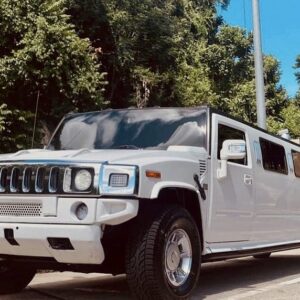 White Hummer limousine parked outdoors, showcasing luxury and style for the ultimate Hummer limo Budapest stag experience.