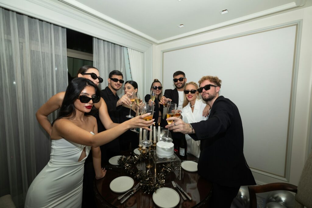 Group celebrating in a stylish party setting, highlighting the fun and convenience of Budapest stag do accommodation options for events.