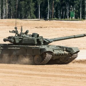 Military tank driving through rugged terrain, showcasing the excitement of the tank driving Budapest stag do activity.