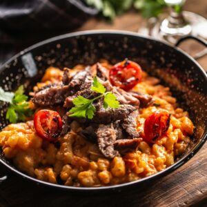 Bowl of hearty Hungarian goulash served with fresh bread, showcasing the traditional flavors of dinner Budapest stag activities.