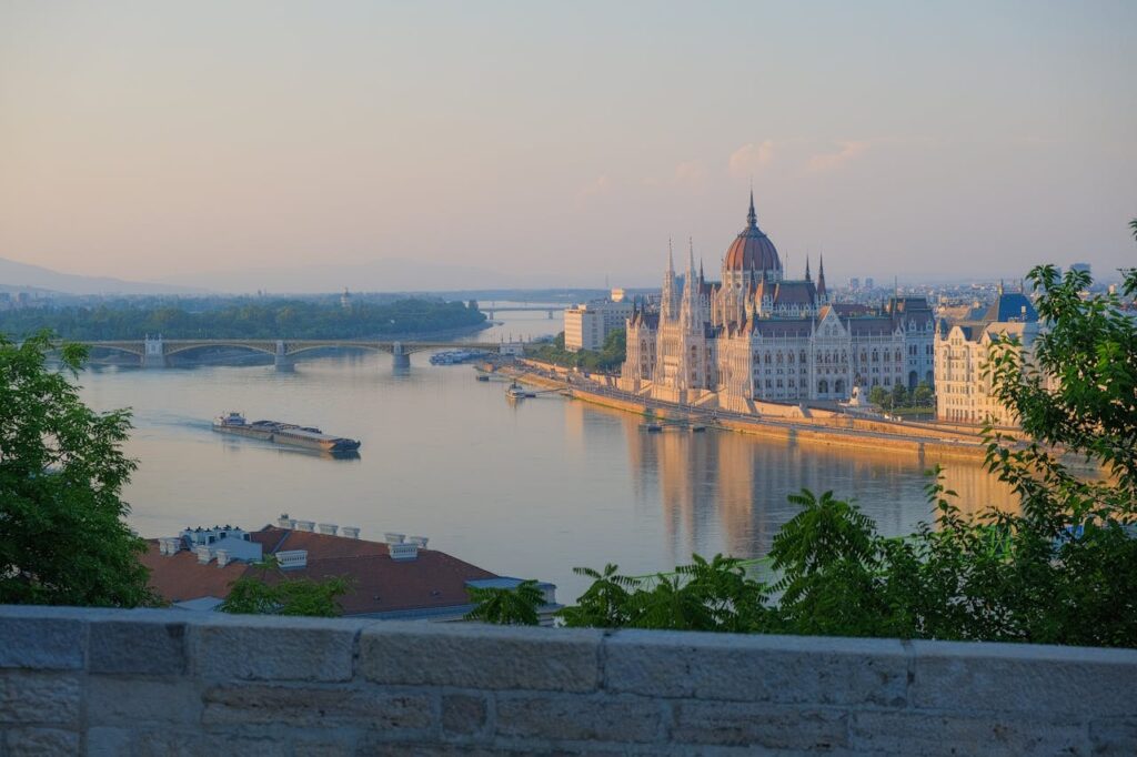 Stunning view of the Hungarian Parliament and the Danube River, showcasing the charm of Budapest stag do accommodation locations.
