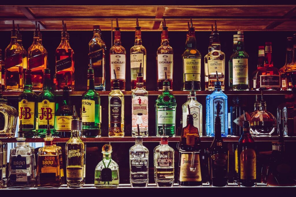 Variety of liquor bottles at a bar for an authentic Budapest stag party nightlife experience