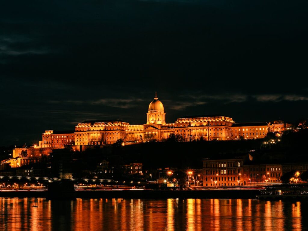 The iconic Buda Castle at night, a stunning backdrop included in many Budapest stag party packages.