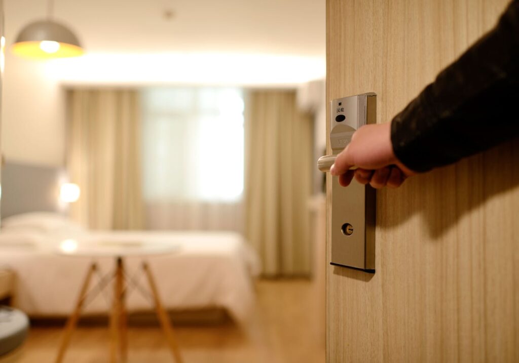 Opening the door to a cozy and modern room, perfect for a relaxing stay after a night out in the city