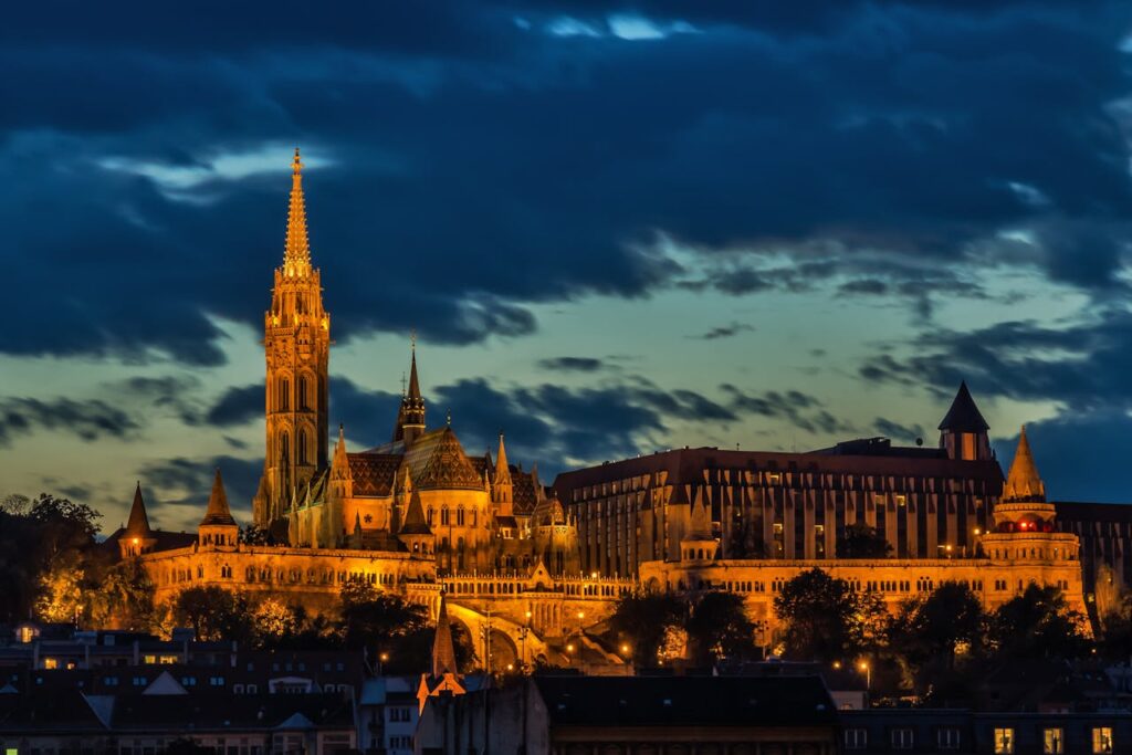 Buda Castle and Fisherman's Bastion illuminated at night for an authentic Budapest stag party experience