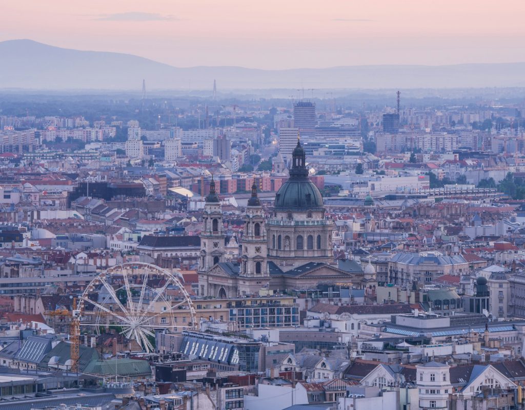 daniel-mirlea-e_wY5vxKszQ-unsplash (1) Panoramic view of Budapest featuring St. Stephen's Basilica, a landmark near some of the best places to stay highlighted in the Budapest stag do guide.