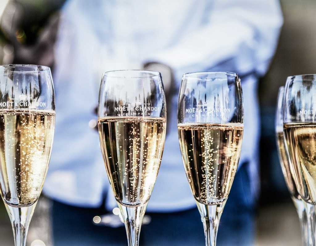 deleece-cook-znXmpb53QJU-unsplash Champagne glasses reflecting a VIP stag experience in Budapest, offering unique nightlife options with exclusive services for stag groups.